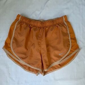 Nike dri fit orange running shorts size women’s medium